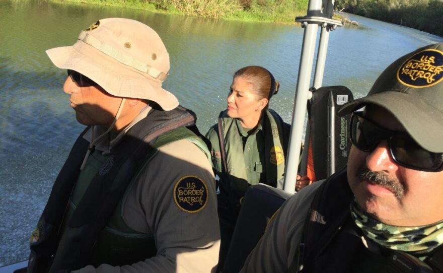 Border Patrol Agents Omar Puente , Marlene Castro and Guillermo Mata on patrol on the Rio Grande near McAllen, Texas.