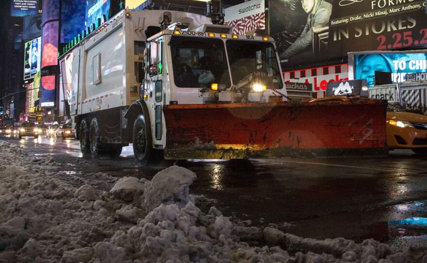 In Times Square on Friday morning, plows were clearing away the snowy mess.