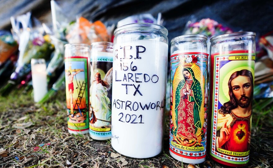 Candles are left outside NRG Park, the site of the deadly Astroworld musical festival in Houston.