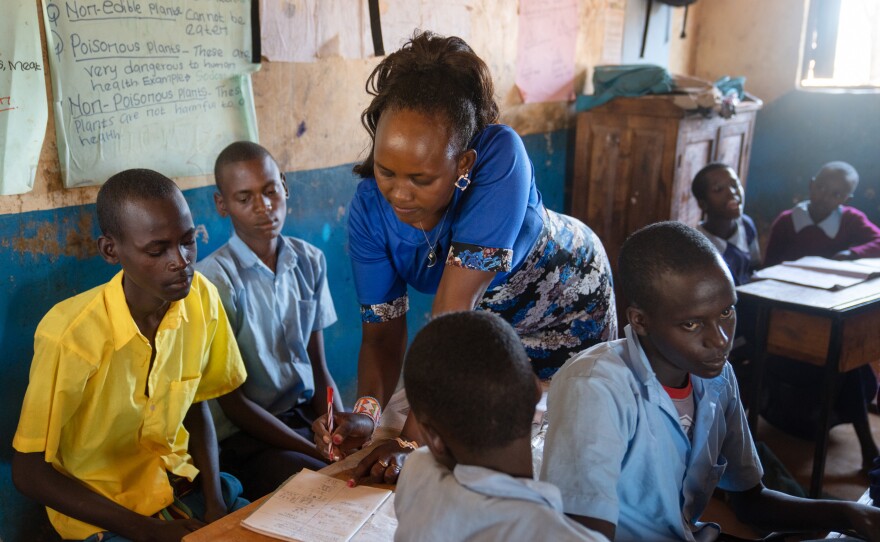 Teacher Florence Lerapayo grades the assignments done by the moran boys. She says they have an enormous amount of catching up to do. But she's also confident that it's not too late for them.