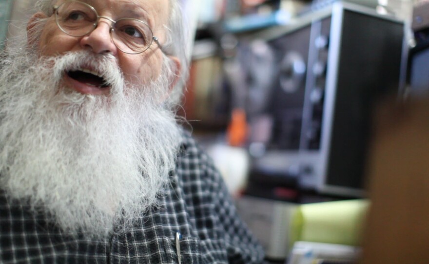 Lou Curtiss plays music for Gregory Page in his store, Oct. 21, 2013.