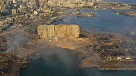 A drone picture shows the scene of an explosion that hit the seaport of Beirut, Lebanon, Wednesday, Aug. 5, 2020. A massive explosion rocked Beirut on Tuesday, flattening much of the city's port, damaging buildings across the capital and sending a giant mushroom cloud into the sky. 
