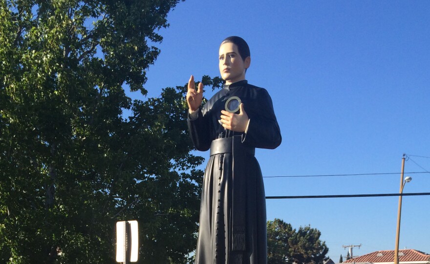 People carry the statue of Saint Toribio Romo in a procession at East Los Angeles' St. Marcellinus Church.