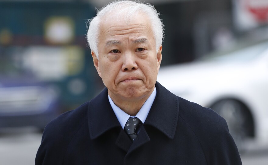 Takata Corp.'s chief financial officer Yoichiro Nomura leaves federal court in Detroit on Monday. Japanese auto parts maker Takata Corp. pleaded guilty to fraud and agreed to pay $1 billion in penalties for concealing an air bag defect.