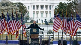 With the White House in the background, President Donald Trump speaks at a rally on Jan. 6, 2021, in Washington.
