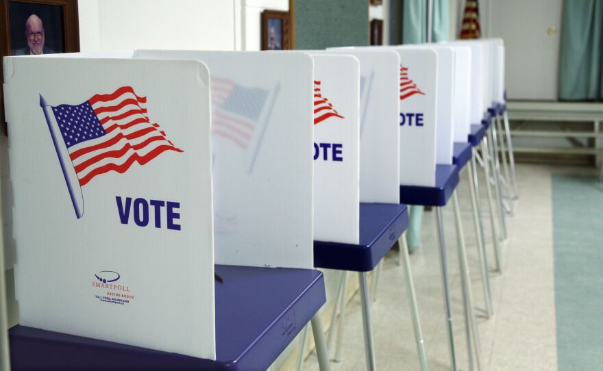 Voting booths at a polling station in Christmas, Fla., on Election Day 2016. A Florida-based company that provides election equipment to localities was hacked by Russia during the 2016 election, the Mueller report found.