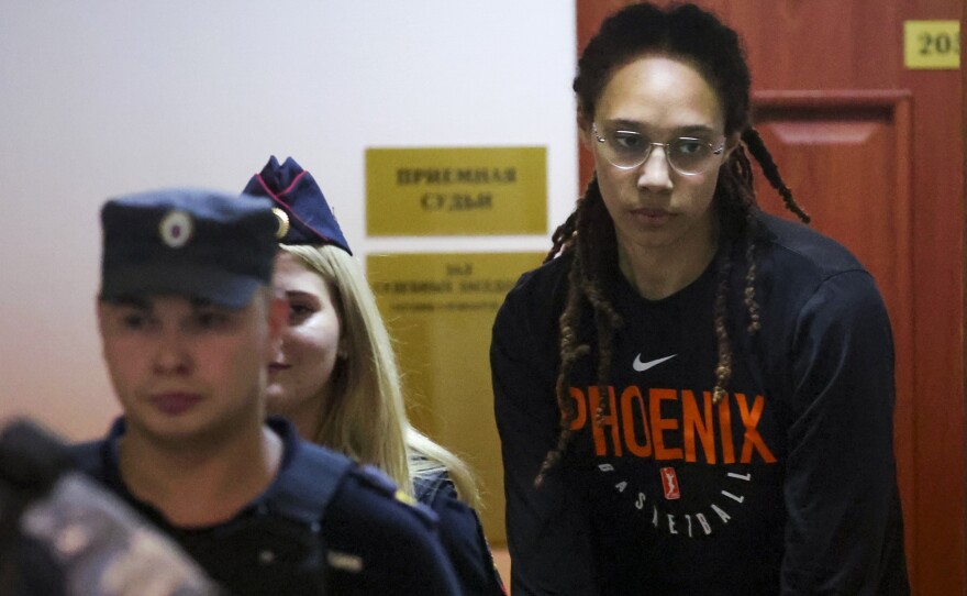 WNBA star and two-time Olympic gold medalist Brittney Griner is escorted to a courtroom for a hearing, in Khimki just outside Moscow, on Wednesday.