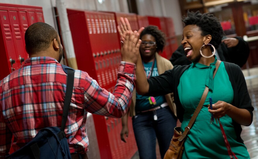 Terrell greets students in the hallway.