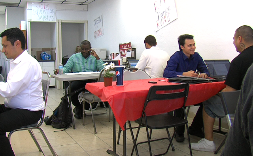 Dwayne Crenshaw makes phone calls to voters from his campaign office.