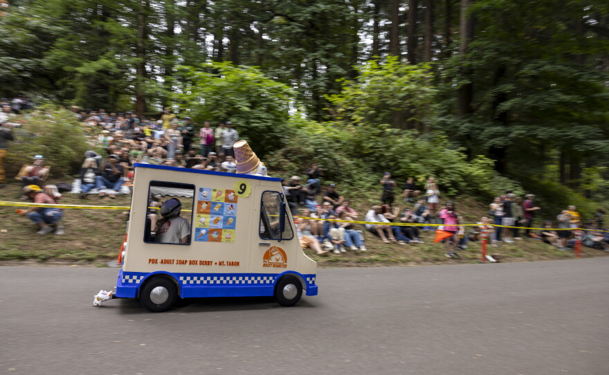 Racers a few moments after the start of the derby at Mt. Tabor Park during the 27th Portland Adult Soap Box Derby on Aug. 15 in Portland, Ore.