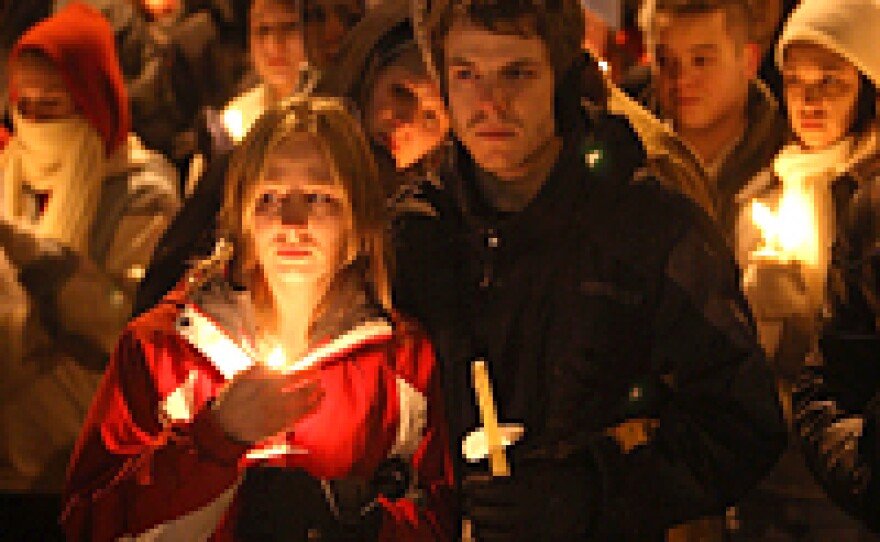 Students gather for a prayer service on the campus of Northern Illinois University to pray for those killed and wounded in Thursday's shooting at Cole Hall.