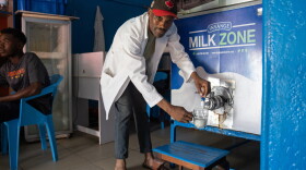 Moses Sansiman taps into cold whole milk at his milk bar. Some milk bars offer a variety of flavors but Sansiman says he likes to keep it simple.
