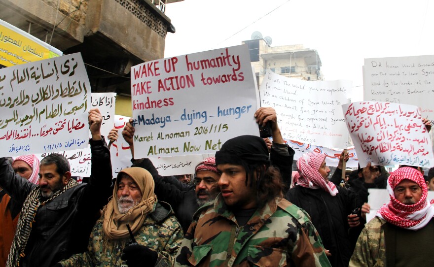 Demonstrators in Idlib, Syria, protested Tuesday on behalf of civilians starving in the besieged town of Madaya, Syria.