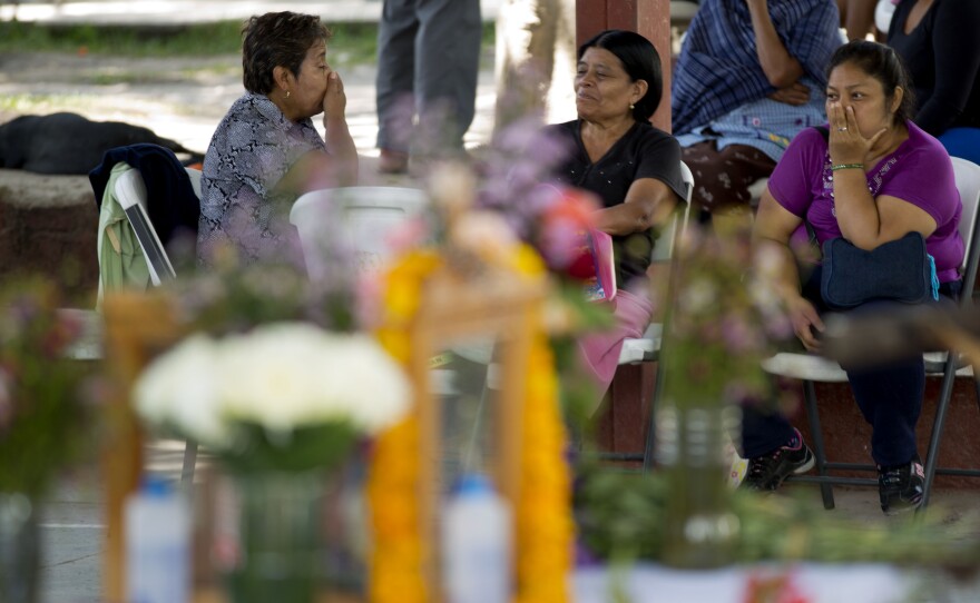 Relatives of students reported missing after a violent confrontation in Iguala with police, pass the time near a makeshift altar as they wait for news of their loved ones at the Isidro Burgos rural teachers college in Ayotzinapa, Mexico.