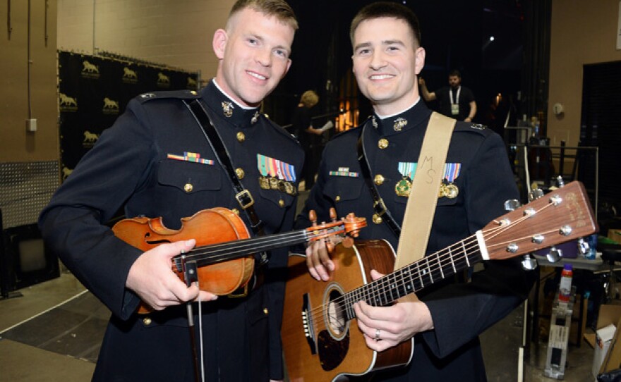 U.S. Marine Corps Capt. Matt Smith and Capt. John Ed Auer perform in this tribute to the men and women who serve the United States. President and Mrs. Obama host the event.