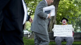 Unemployed circus clown Tim Torkildson, aka Dusty the Clown, sits on a bench on the north side of the U.S. Capitol in May.
