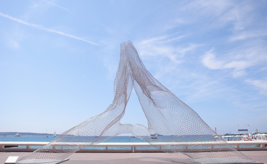 <em>Together,</em> a sculpture by Lorenzo Quinn, was unveiled during the 74th annual Cannes Film Festival on July 6, 2021.