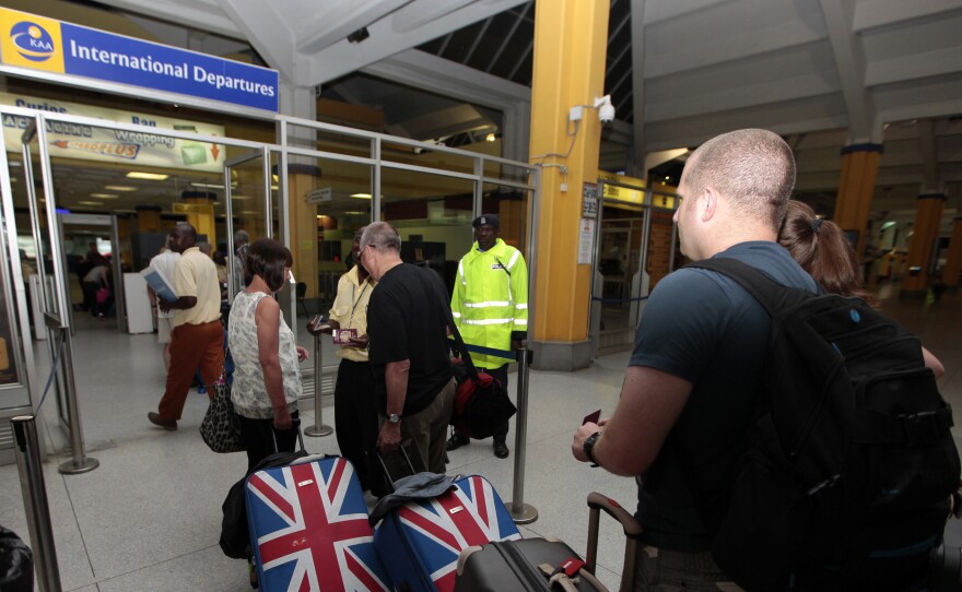 British tourists queue at a departure gate at Moi International Airport in the Kenyan coastal city of Mombasa, May 15. Hundreds of tourists were evacuated after Britain, the United States, Australia and France issued travel warnings for Kenya after a series of terrorist attacks.