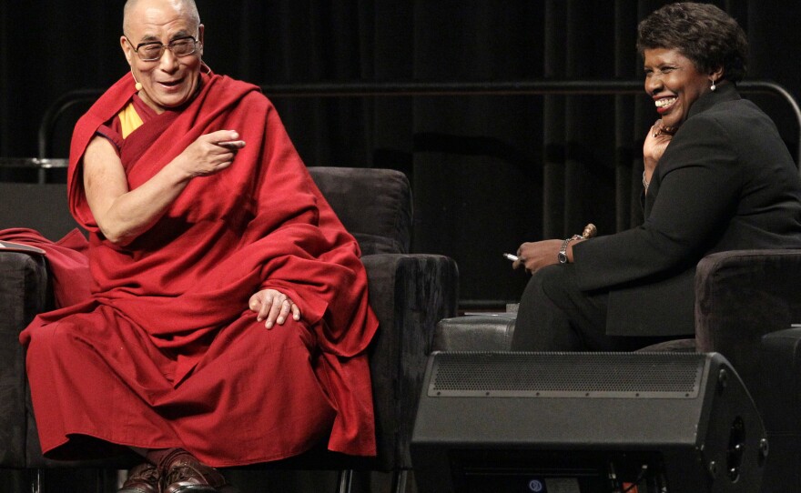 The Dalai Lama answers questions from moderator Ifill in October 2010 at the National Underground Railroad Freedom Center luncheon in Cincinnati.