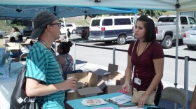Michelle Alcantar, Vista Community Clinic certified enrollment counselor, answers questions about Medical, CalFresh and CalWORKs Cash Aid at the North County Homeless Connection event, Oct 10, 2015.

