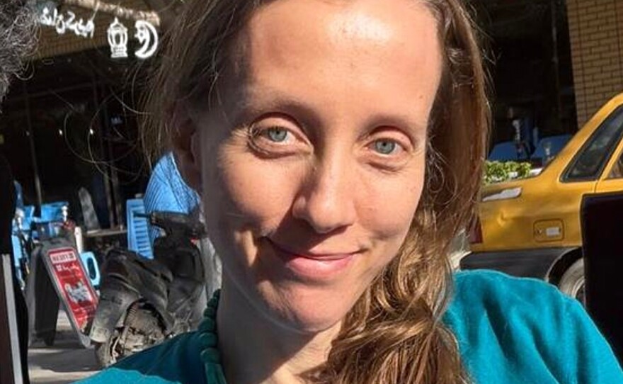 U.S. journalist Shelly Kittleson poses for a cellphone photo in a cafe in Baghdad, Iraq, March 30.