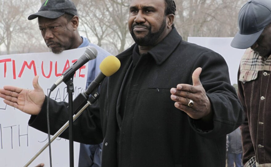 John Boyd (center), president and founder of the National Black Farmers Association, says black farmers have been systematically denied loans and treated unfairly by the Department of Agriculture for years. In February, he and other black farmers gathered at the Agriculture Department in Washington to urge settlement of a class-action lawsuit.
