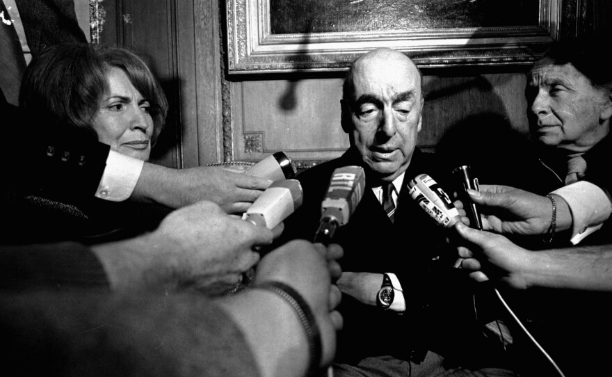 Poet Pablo Neruda talks with reporters Oct. 21, 1971, in Paris after being awarded that year's Nobel Prize for Literature.