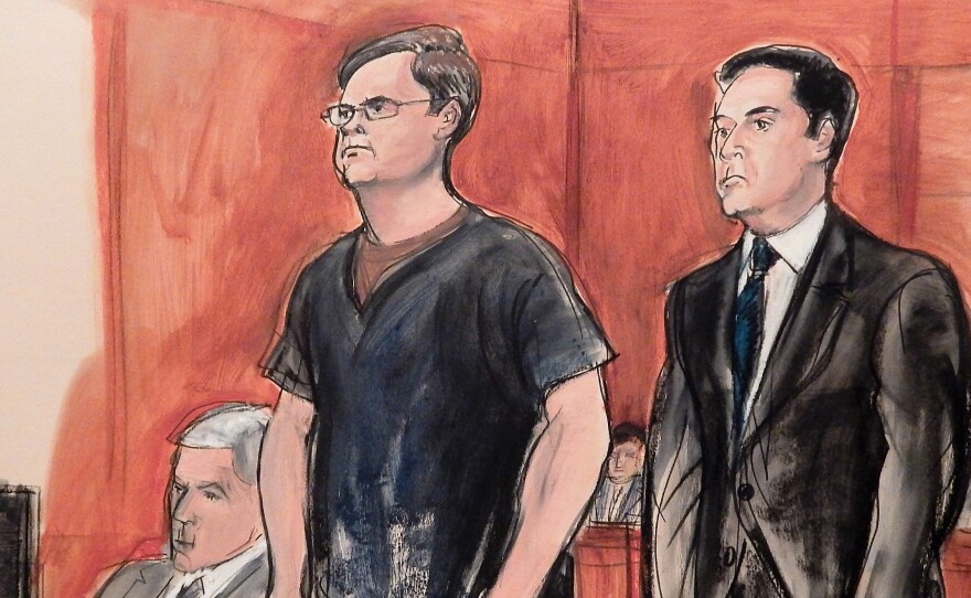 In this courtroom drawing, Russian banker Evgeny Buryakov, left, stands with attorney Scott Hershman during sentencing on espionage charges on May 25 in New York.