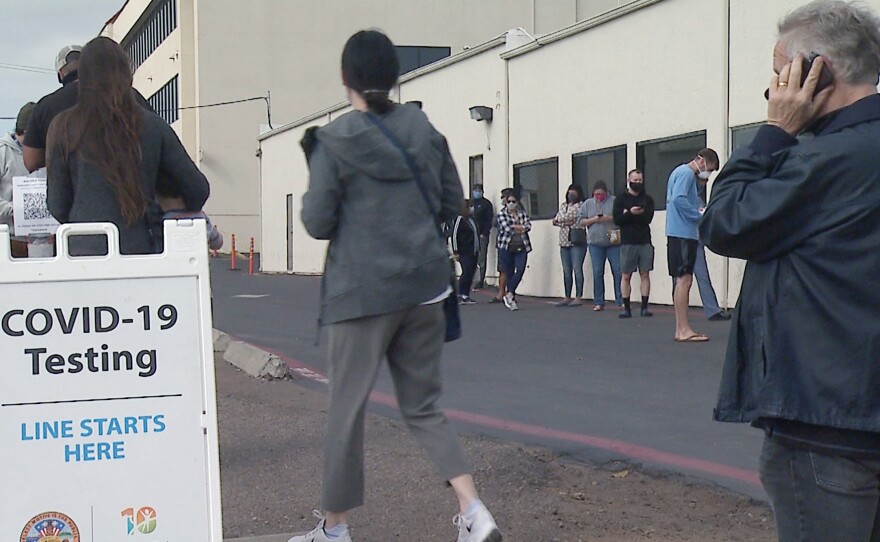 A long line of people waiting to get tested at the USD Former USD Electronics Recycling Center testing site. Nov. 23, 2020.