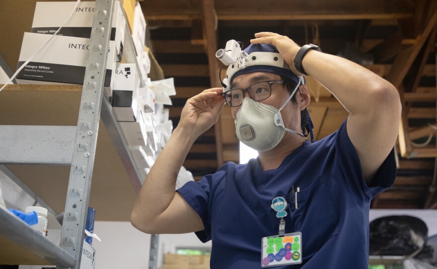 Dr. Aram Harijan, who provides wound care services to two dozen San Diego County nursing homes, organizes his medical equipment before starting work on June 29, 2020.