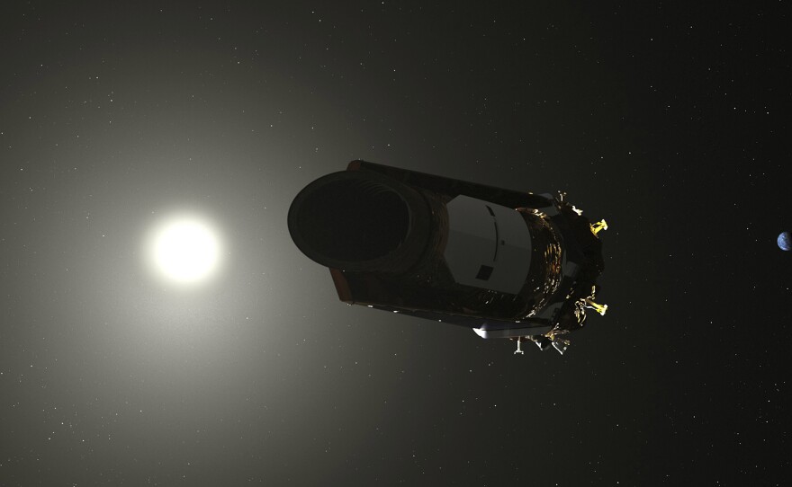 This illustration made available by NASA shows the Kepler space telescope, the planet-hunting spacecraft that launched in 2009.
