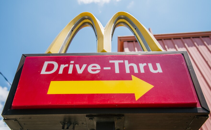 A McDonald's sign is shown on July 28 in Houston, Texas. One of the winners of the Nobel Prize in economics on Monday was cited for his work in studying the fast food industry to help determine how minimum wages impact employment.