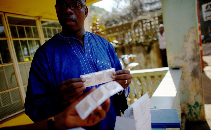 Abu Bakarr Koroma is part of a condom handout program to prevent HIV and other sexually transmitted diseases. These days, he can't even give 'em away.