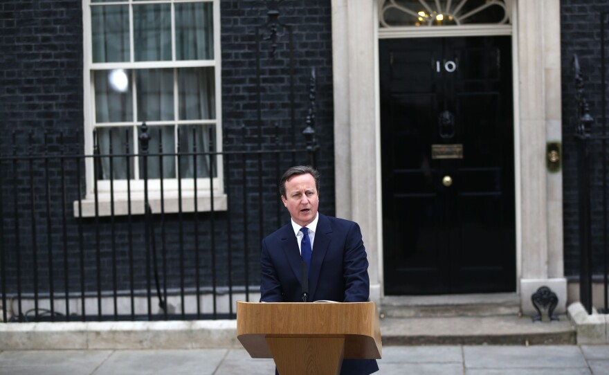 British Prime Minister David Cameron speaks in front of No. 10 Downing St. after meeting with Queen Elizabeth II on Monday.
