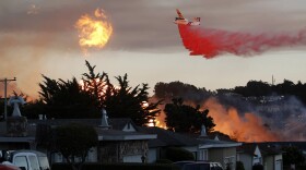 In this Sept. 9, 2010, file photo, a massive fire following a pipeline explosion roars through a mostly residential neighborhood in San Bruno, Calif. A federal jury found Pacific Gas & Electric Co., California's largest utility, guilty on Tuesday, Aug. 9, 2016, of misleading investigators about how it was identifying high-risk pipelines after the deadly gas line explosion in the San Francisco Bay Area.