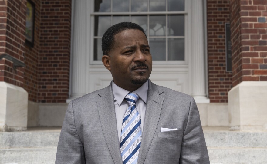 Pastor John Perry in front of City Hall in downtown Brunswick. On the justice system and the differences between how white and Black people are treated, "Some people call it the good old boy system. I call it relationships of privilege."