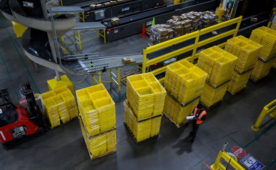 A man works at an Amazon fulfillment center in Staten Island, New York. The retail giant faces a major labor battle with a unionization vote planned at a similar warehouse in Alabama.