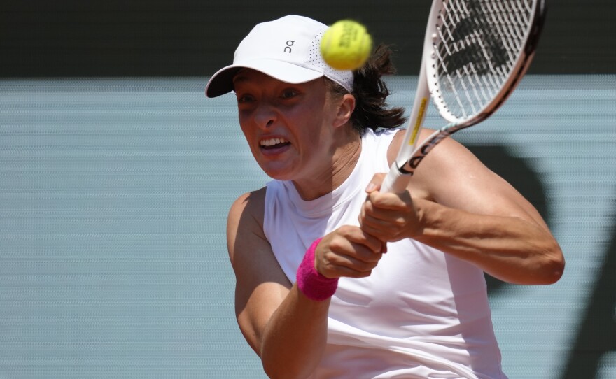 Poland's Iga Swiatek plays a shot against Coco Gauff of the U.S. during their quarterfinal match of the French Open tennis tournament at the Roland Garros stadium in Paris, Wednesday, June 7, 2023.