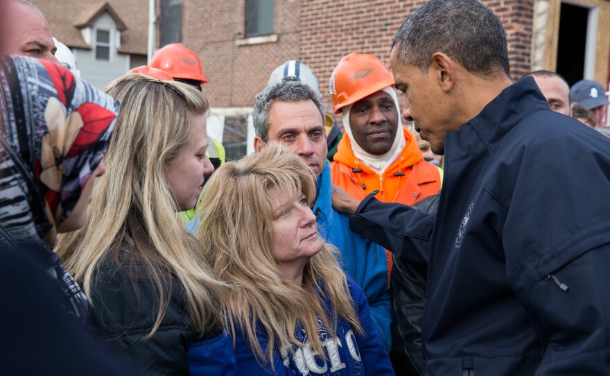 President Obama talks with Diane and Nick Camerada (center) during a walking tour of Superstorm Sandy storm damage on Staten Island, N.Y., on Nov. 15, 2012.