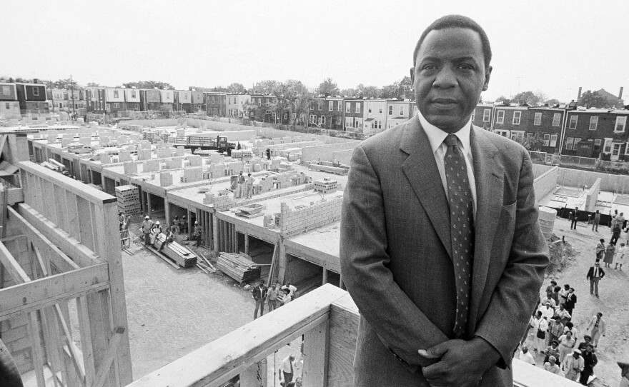 Philadelphia Mayor Wilson Goode stands on the roof of a newly constructed home, Sept. 17, 1985 in Philadelphia on the site of the deadly battle with the group MOVE. Homeowners burned out as a result of the police siege of the MOVE headquarters watch the rebuilding process with skepticism.