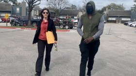Landlord Stephanie Graves walks to the main office at one of her properties in Houston with a resident. She's going door to door offering to help residents apply for rental assistance money approved by Congress that's just starting to flow to landlords and tenants.