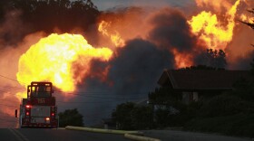 Flames from a massive fire are seen in a residential neighborhood September 9, 2010 in San Bruno, California. A massive explosion rocked a neighborhood near San Francisco International Airport. 