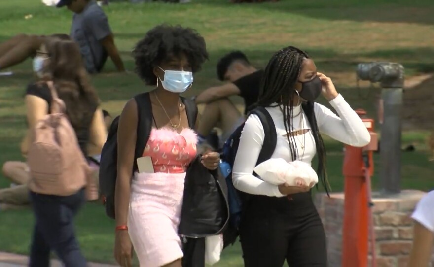 Students walking through San Diego State campus on the first day of class, Aug. 23, 2021.