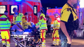 Emergency personnel tend to a person on a stretcher following the cancellation of Christopher Street Day in Berlin on Saturday, July 25, 2026.