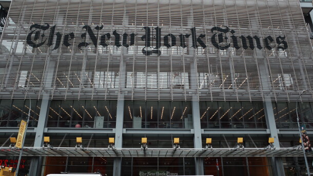 The New York Times says federal agents showed up at several of its journalists' homes Friday night to try to force them to testify before a grand jury next week.