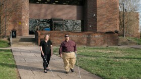 Miranda Lacy and Harold Rogers walk around the campus of West Virginia State University, where both completed undergraduate degrees. They consider the campus a second home because staff there worked hard to make sure their education was accessible. Now, they're in a graduate program that they say has failed to make their learning materials accessible and have filed a lawsuit.
