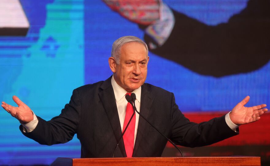 Israeli Prime Minister Benjamin Netanyahu, leader of the Likud party, addresses supporters at the party campaign headquarters in Jerusalem early Wednesday after the end of voting in the fourth national election in two years.