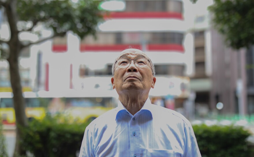 Seiichiro Mise looks up to the sky. He was 11 years old when the bomb fell on Nagasaki.