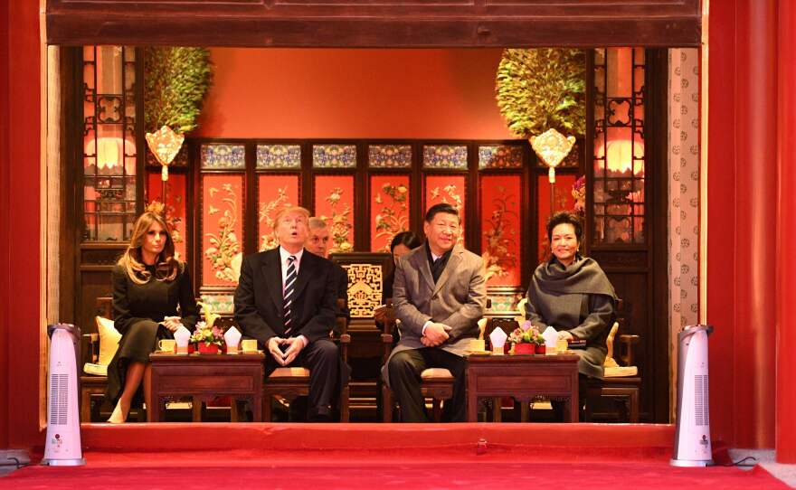 Chinese President Xi Jinping and his wife, Peng Liyuan, hosted President Trump and first lady Melania Trump during a tour of the Forbidden City in Beijing on Wednesday at the start of the third leg of Trump's Asian tour.