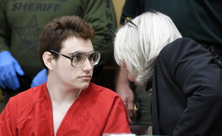 Nikolas Cruz speaks to public defender Diane Cuddihy, right, during a hearing in March.